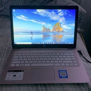 HP Laptop, color is soft purple, with a 14” youTouchscreen.